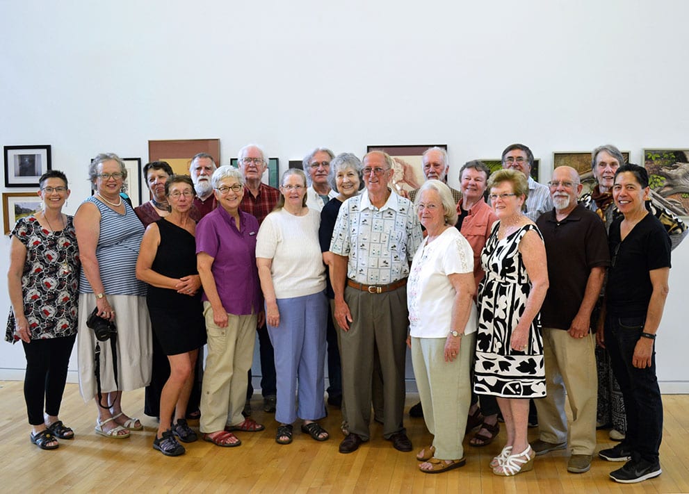 All of the artists for the opening stand in a group photo.