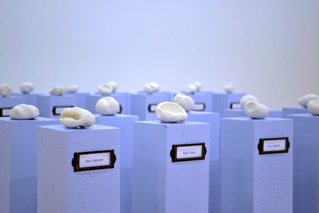 Small clay imprints neatly arranged onto platforms.