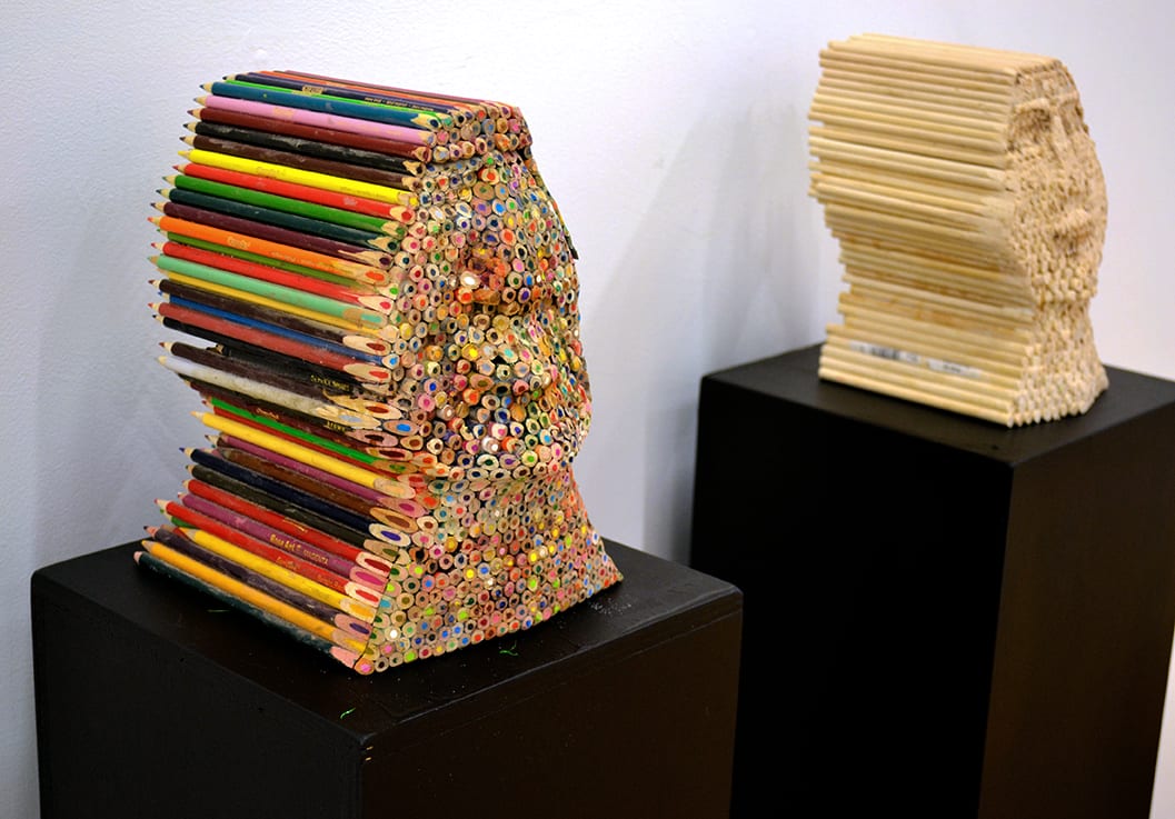 Busts made from colored pencils and dowels.
