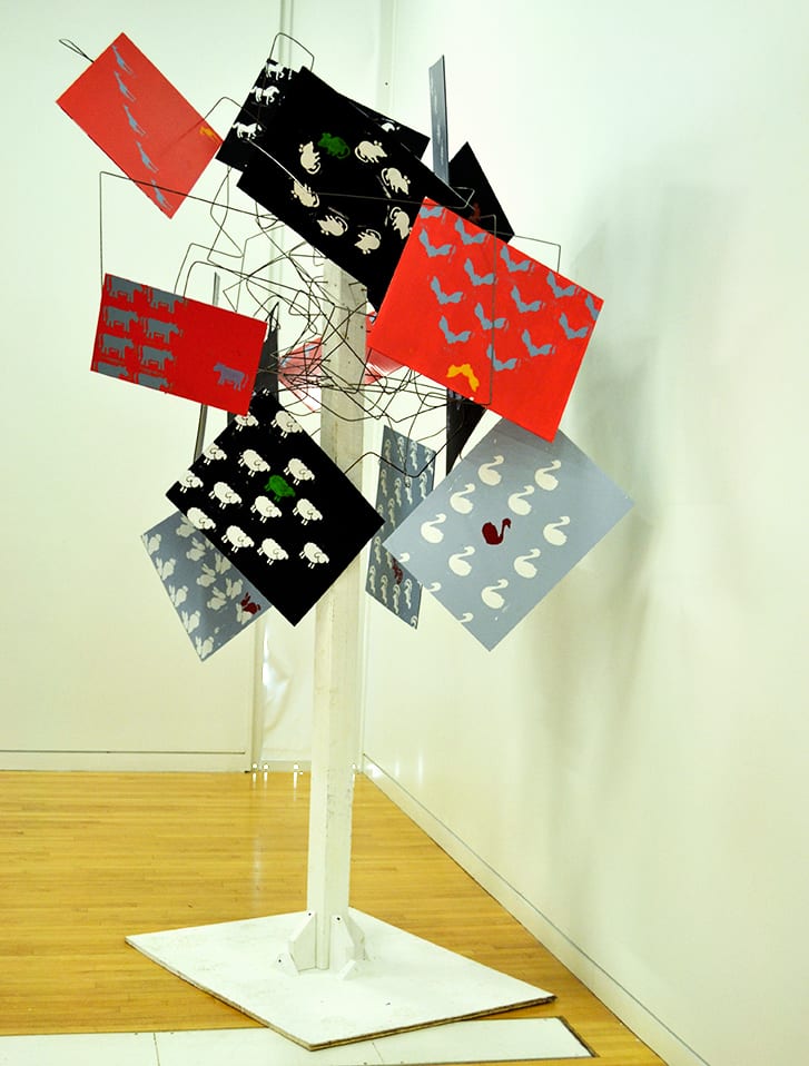 Large sculptural form made from painted signage.