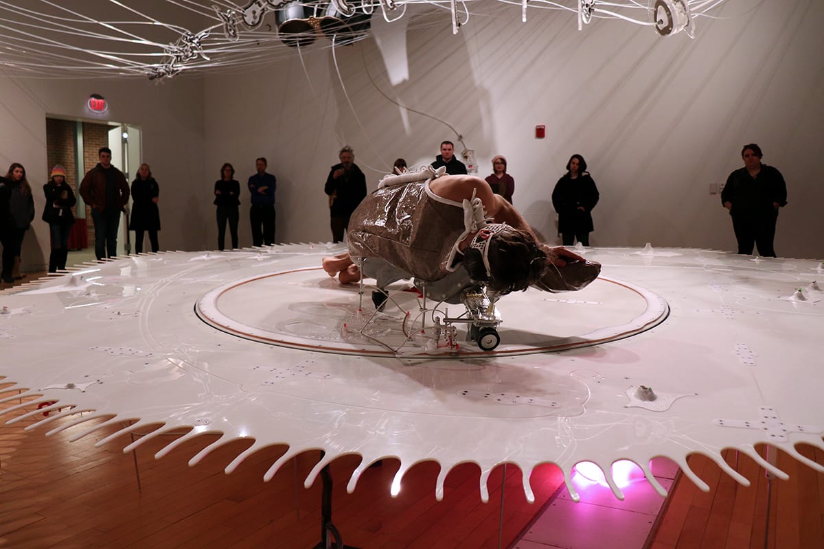 Students attend the opening of John Umphlett's Elements of Degradation.