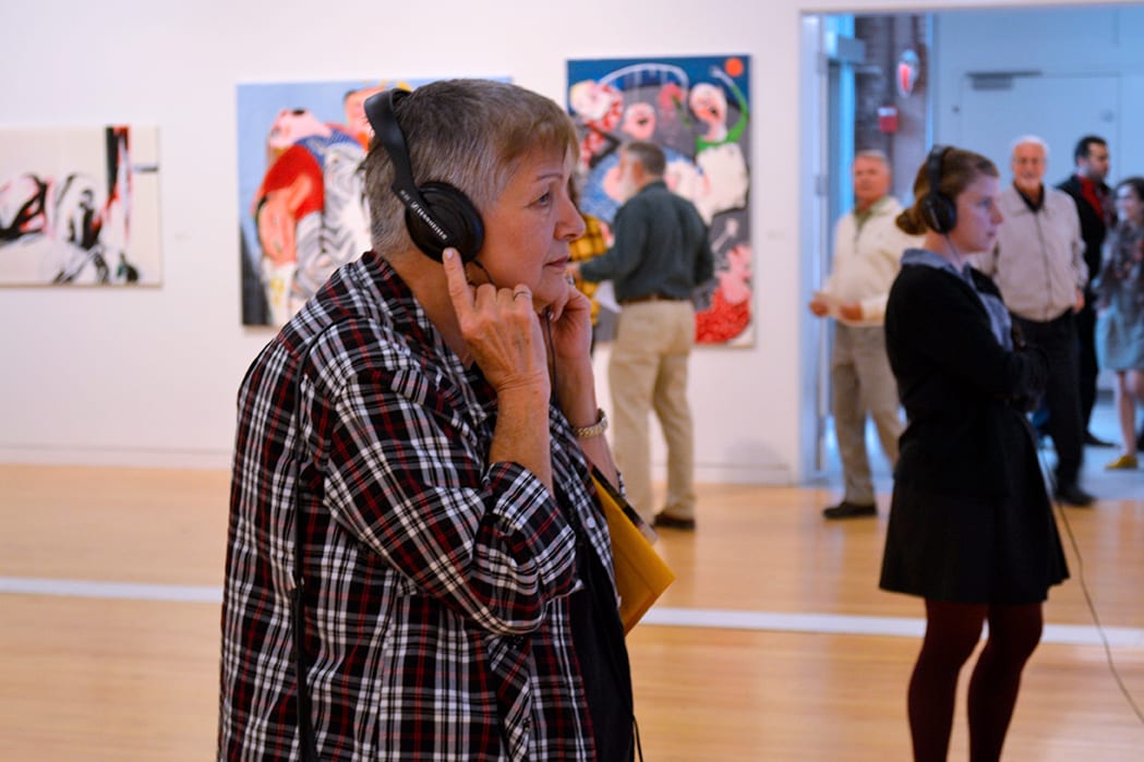 A visitor is watching an animation from the show.