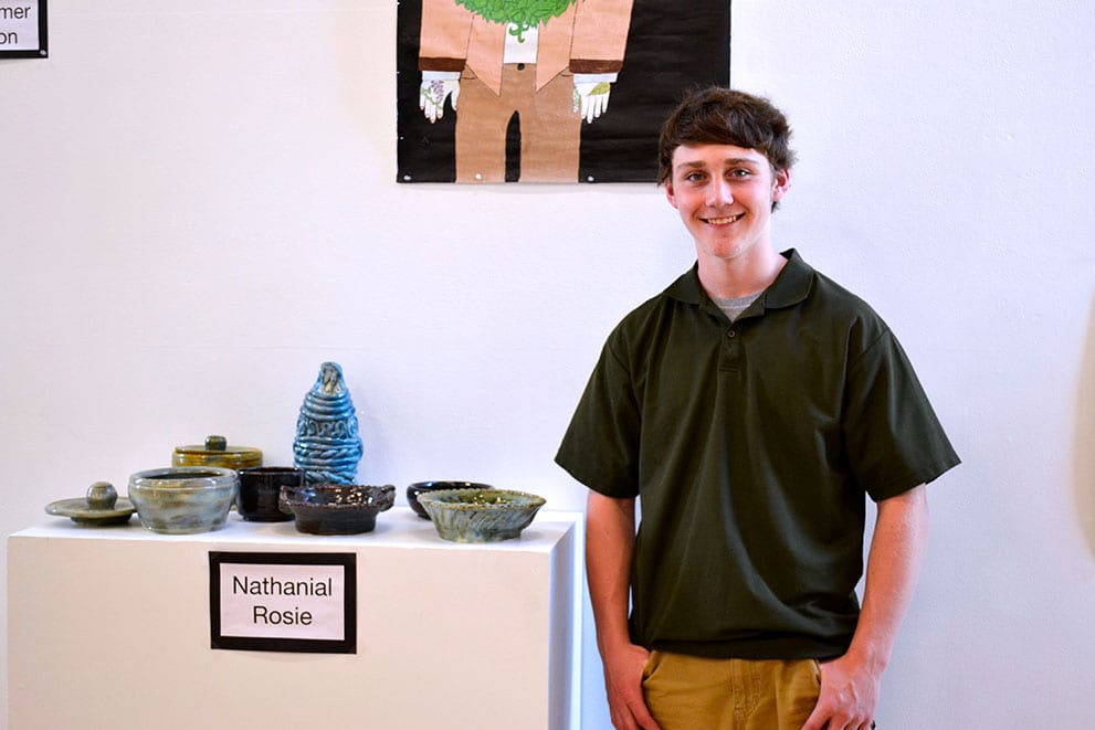 A student displays his work.