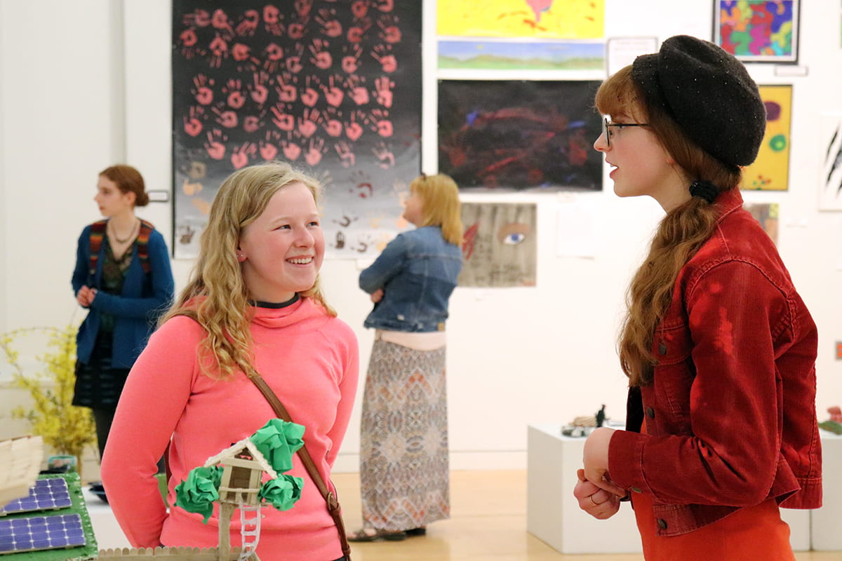 Students talk about their artwork.