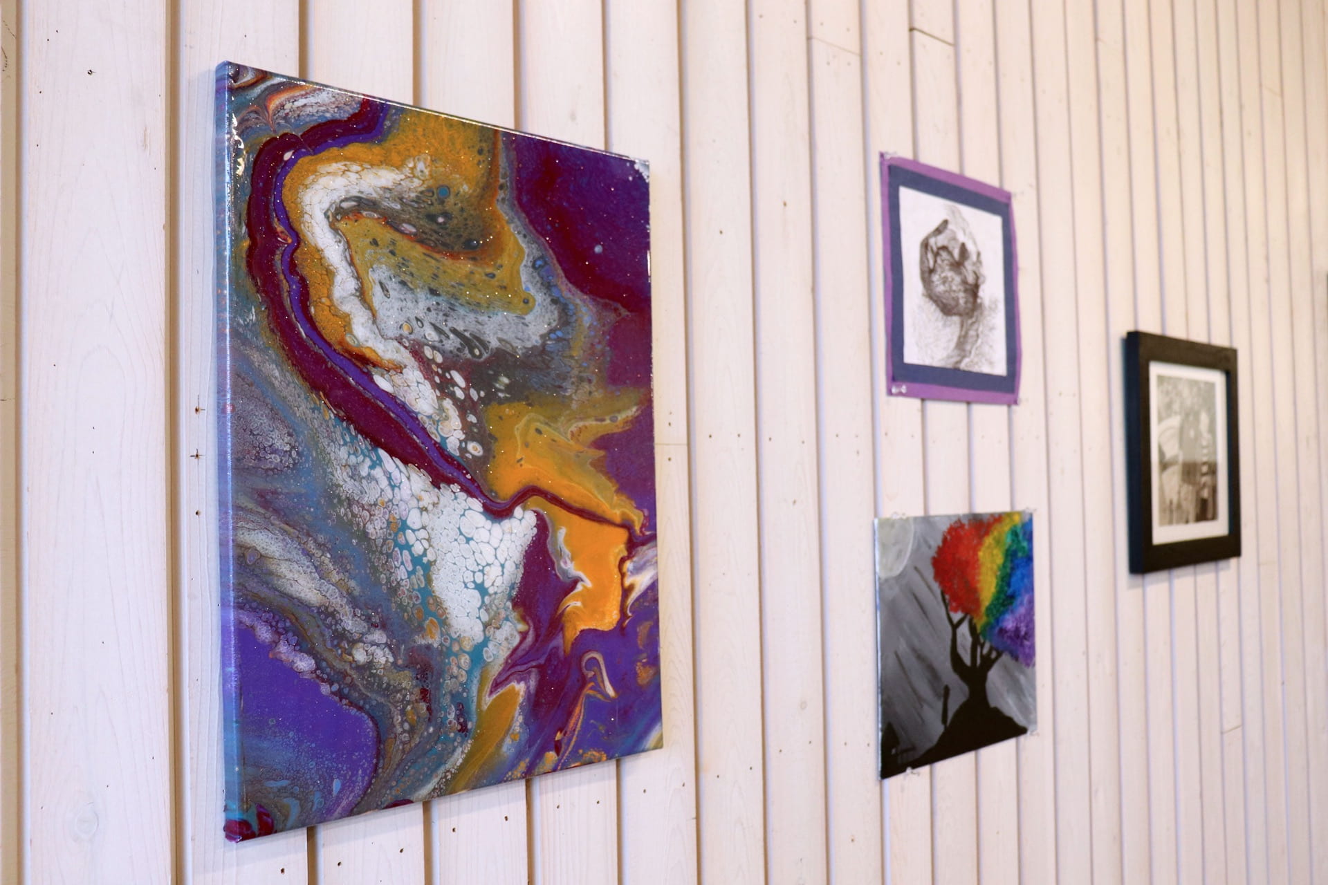 An acrylic pour canvas at the first gen art exhibition.