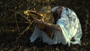 El Coyote "in the den," from the series The National Bird, work in progress. Bosco dell'Osellino, Venice, Italy. Still video by Furio Ganz, Valeria Segna. Coyote by Juri Bizzotto